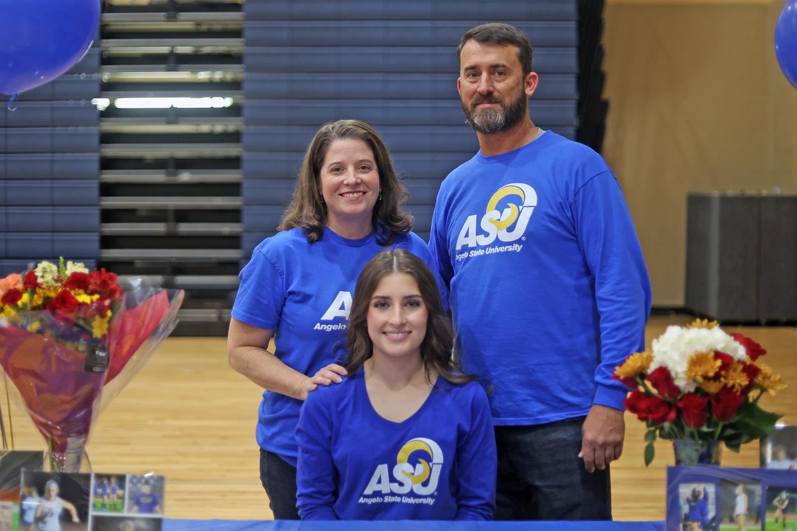 Cypress Ranch High School senior Hannah Carrier, seated, signed a letter of intent to play soccer at Angelo State University.